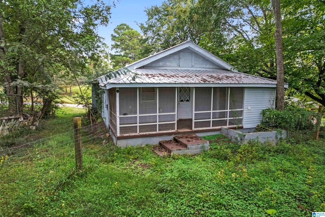 view of front facade featuring a sunroom