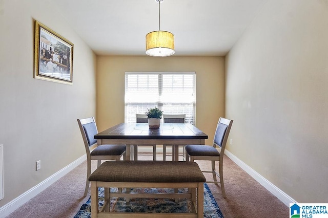 view of carpeted dining area