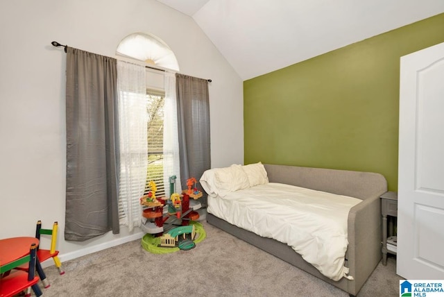 carpeted bedroom featuring vaulted ceiling