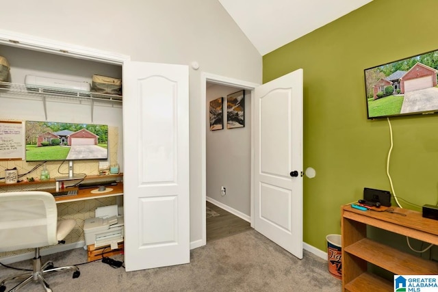 office space featuring lofted ceiling and light carpet