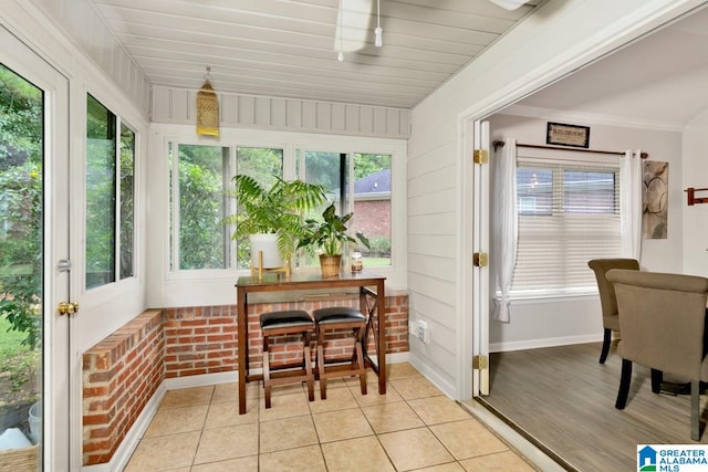 sunroom / solarium featuring plenty of natural light