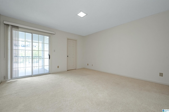 empty room featuring light carpet