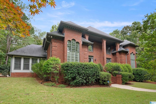 view of side of home featuring a yard