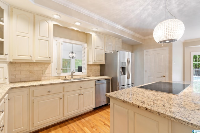 kitchen with pendant lighting, sink, light hardwood / wood-style flooring, a chandelier, and appliances with stainless steel finishes