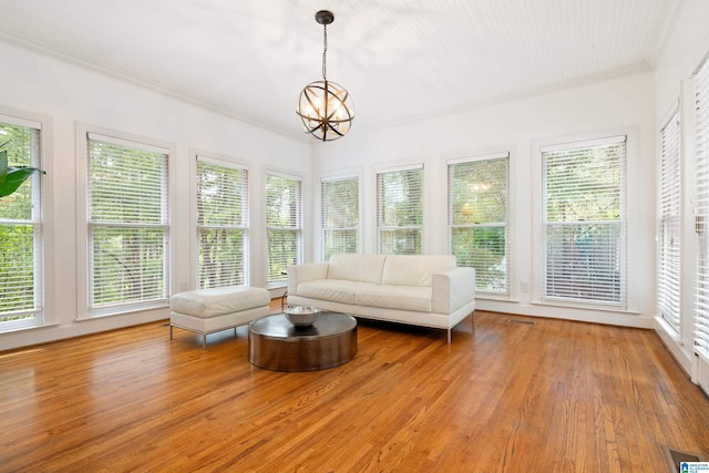 unfurnished sunroom featuring an inviting chandelier and a healthy amount of sunlight