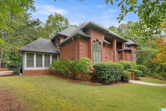 view of home's exterior with a lawn