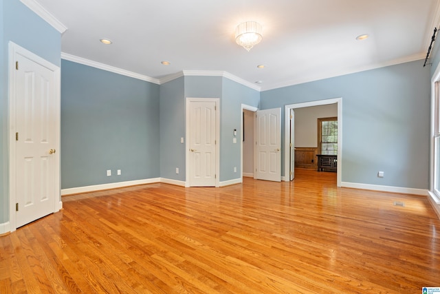 unfurnished bedroom with light hardwood / wood-style flooring and ornamental molding