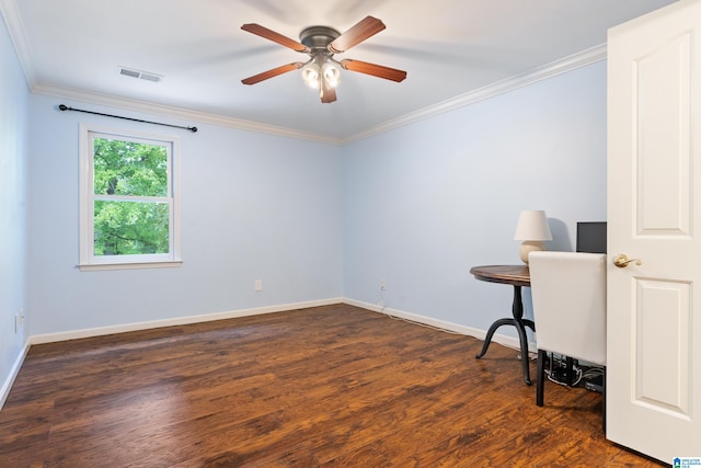 empty room featuring ceiling fan, ornamental molding, and dark wood-type flooring