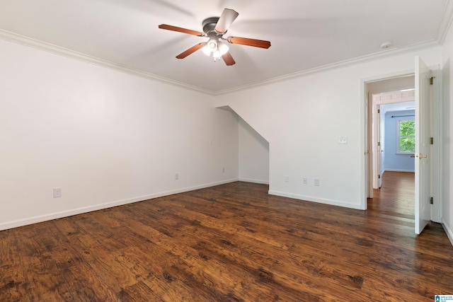 unfurnished room with ceiling fan, crown molding, and dark wood-type flooring