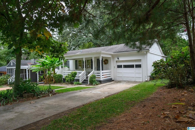 ranch-style house with a garage and a porch