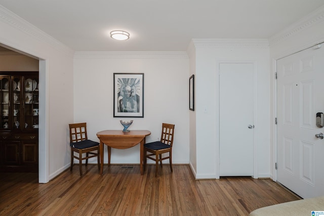 interior space with crown molding and dark wood-type flooring