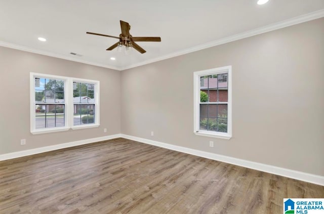 unfurnished room featuring ceiling fan, hardwood / wood-style flooring, and crown molding