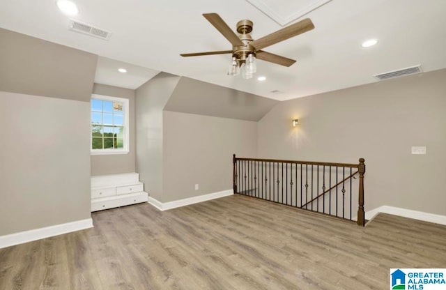 bonus room featuring lofted ceiling, ceiling fan, and hardwood / wood-style flooring