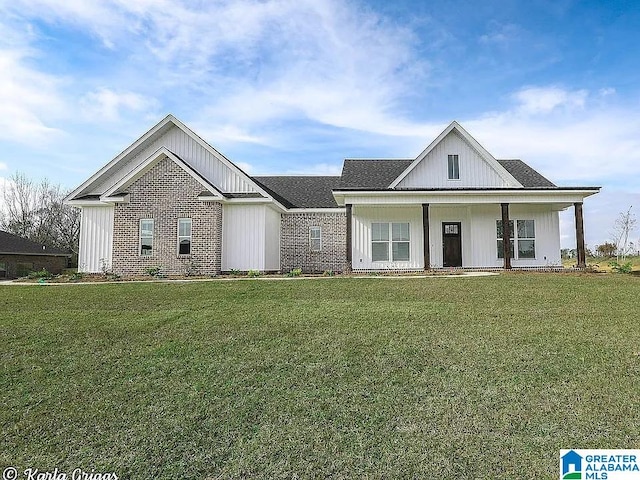 modern inspired farmhouse with a front lawn