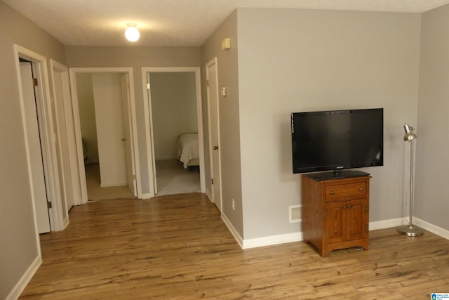 corridor featuring light hardwood / wood-style flooring