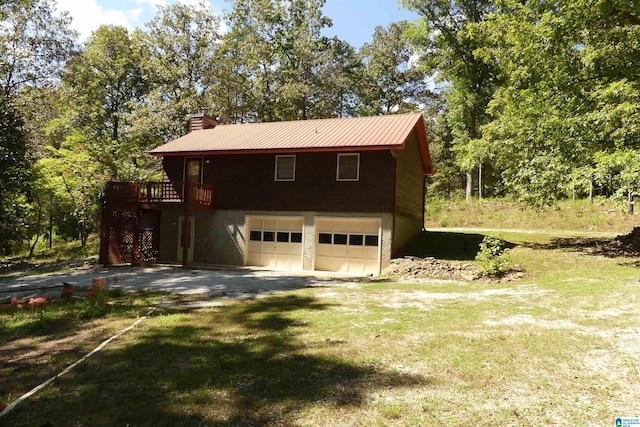 garage featuring a lawn