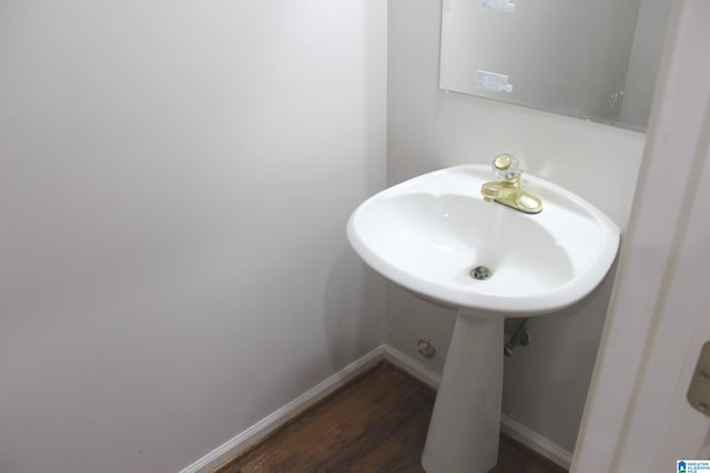 bathroom with hardwood / wood-style floors