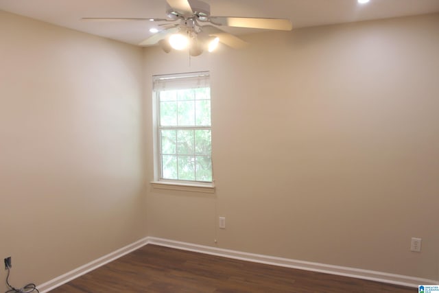 empty room featuring ceiling fan and dark wood-type flooring