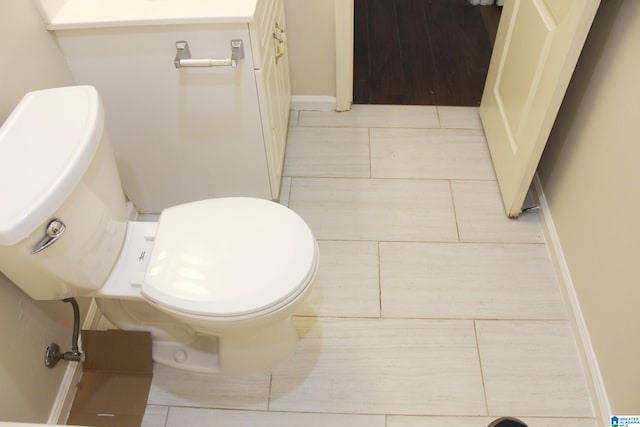 bathroom featuring hardwood / wood-style floors and toilet