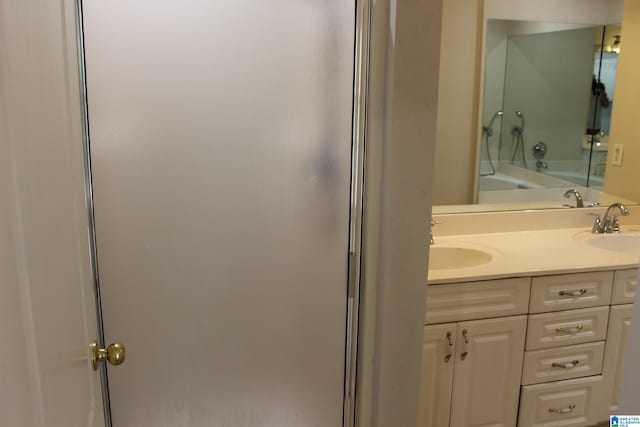 bathroom featuring bathtub / shower combination and vanity