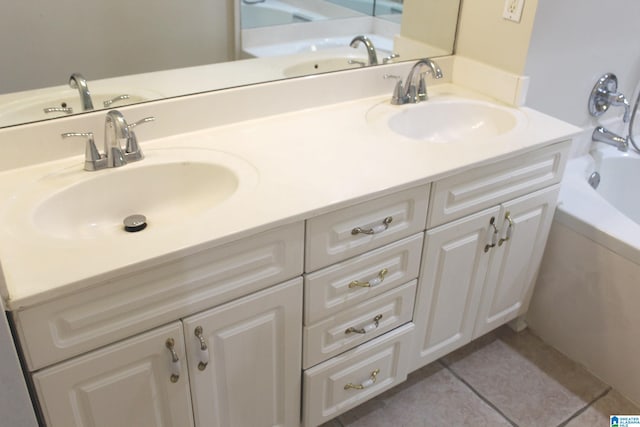 bathroom featuring vanity, a bathing tub, and tile patterned floors