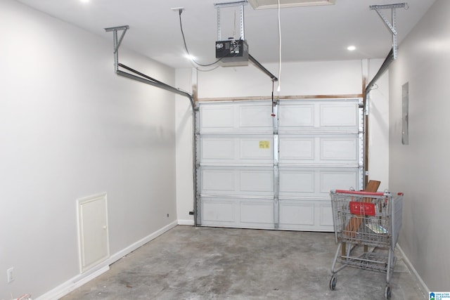 garage featuring a garage door opener and electric panel