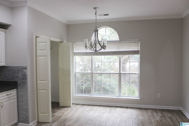 kitchen with pendant lighting, light hardwood / wood-style flooring, and white cabinets