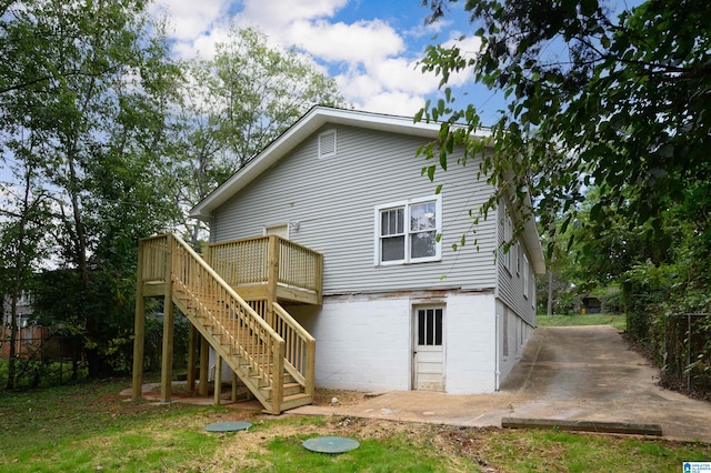 back of house featuring a deck