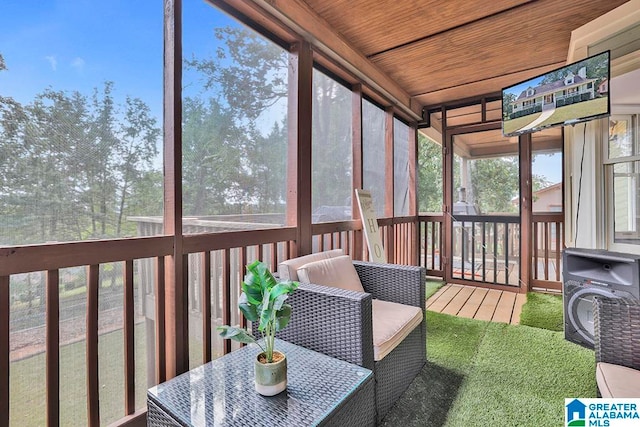 sunroom / solarium featuring wooden ceiling