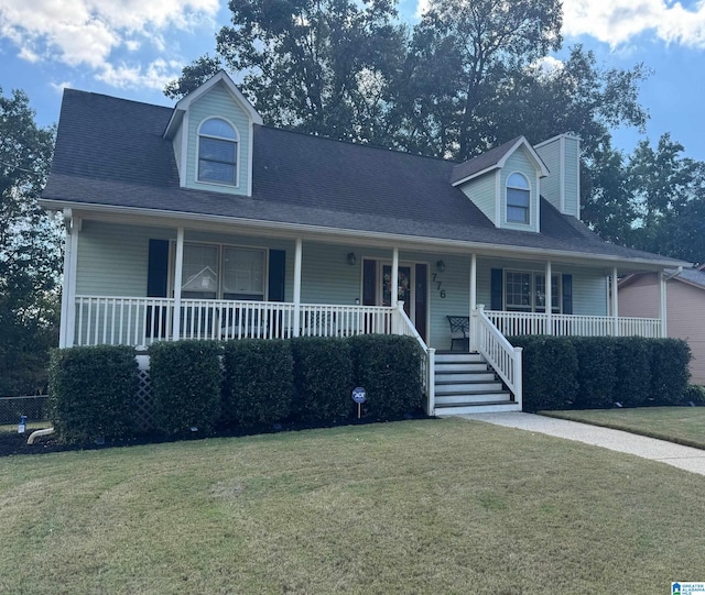 view of front of home featuring a front lawn and covered porch