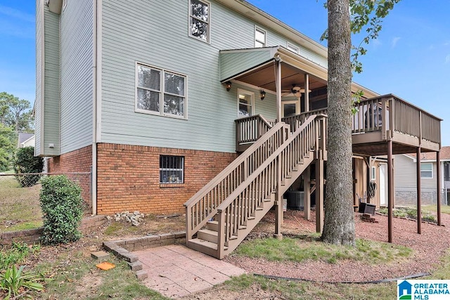 back of house with ceiling fan