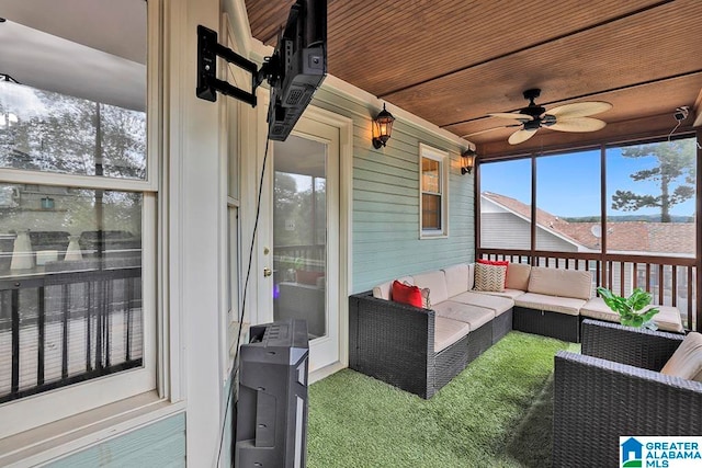 sunroom / solarium featuring ceiling fan and wooden ceiling