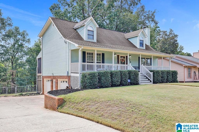 cape cod-style house featuring a front yard, a garage, and a porch