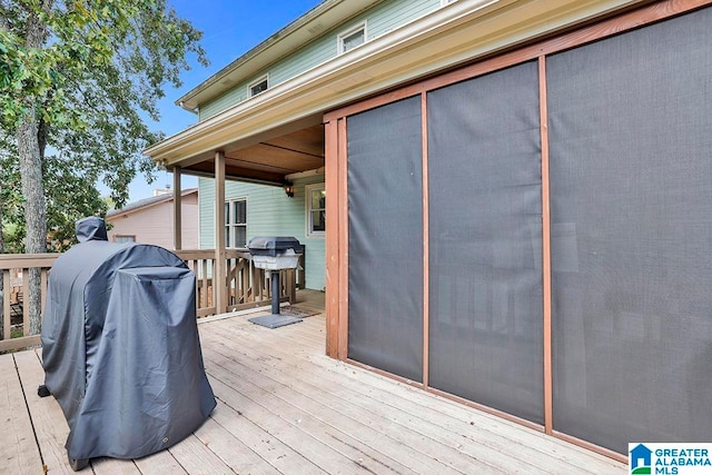 wooden terrace with area for grilling