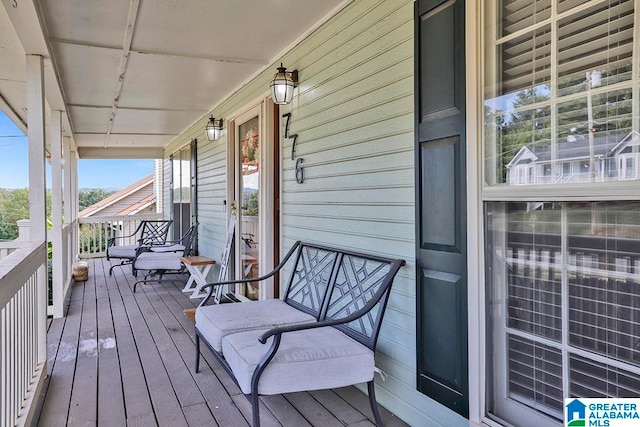 wooden deck featuring covered porch