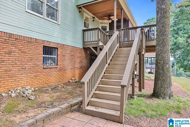 view of exterior entry featuring ceiling fan