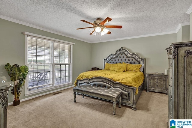 carpeted bedroom with a textured ceiling, ornamental molding, and ceiling fan