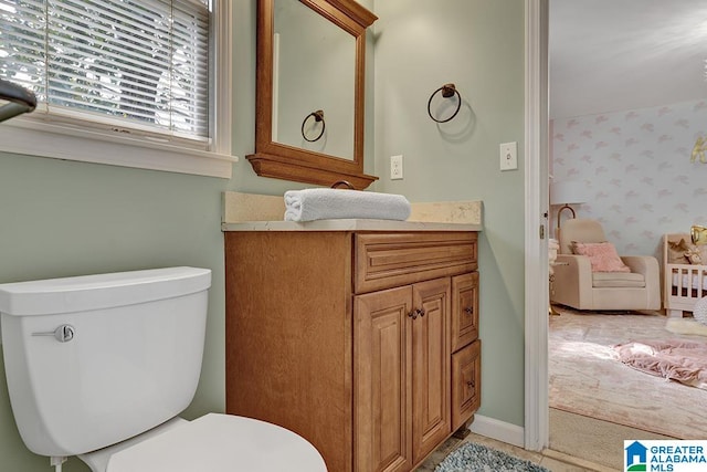 bathroom featuring vanity and toilet