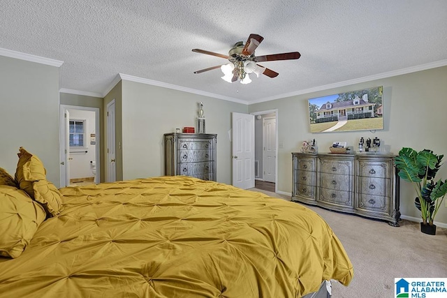 carpeted bedroom featuring connected bathroom, ceiling fan, a textured ceiling, and crown molding