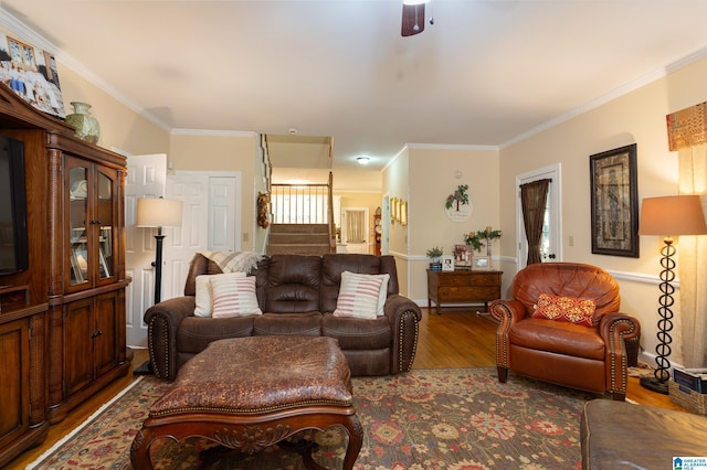 living room with ceiling fan, hardwood / wood-style floors, and crown molding