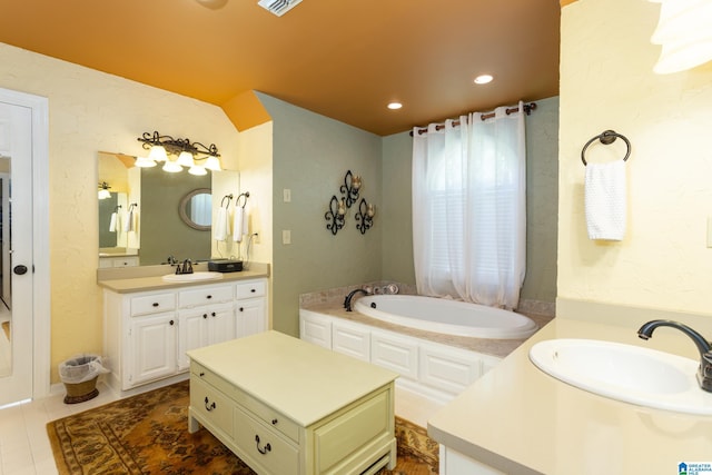 bathroom featuring two vanities, a garden tub, a sink, and tile patterned flooring