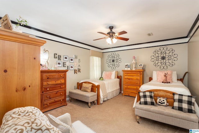 bedroom with crown molding, visible vents, a ceiling fan, and light colored carpet