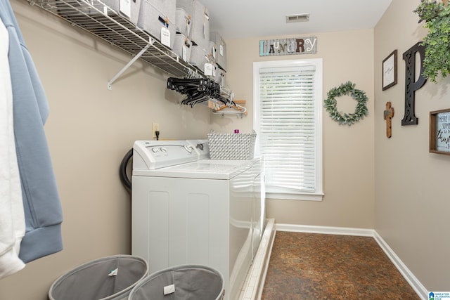 clothes washing area featuring baseboards, washer / dryer, laundry area, and visible vents