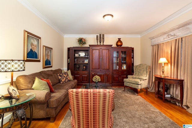 living room featuring ornamental molding and wood finished floors
