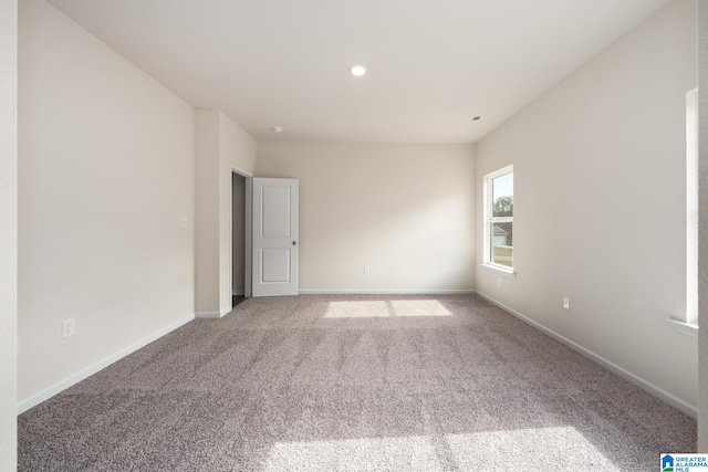 unfurnished room featuring carpet flooring