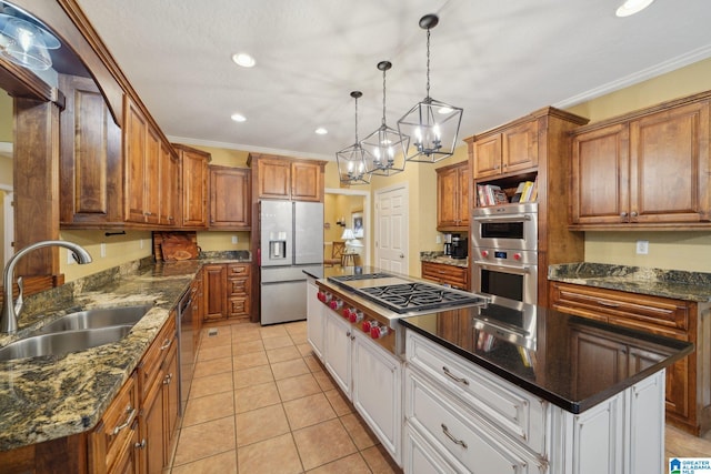 kitchen featuring white cabinets, stainless steel appliances, ornamental molding, and a kitchen island