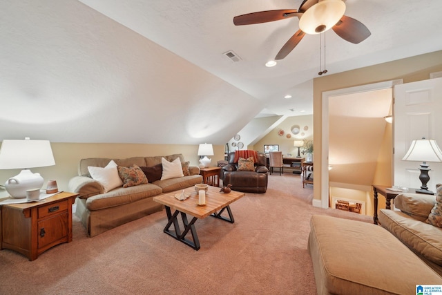 carpeted living room featuring vaulted ceiling and ceiling fan