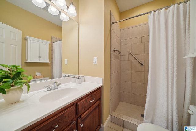 bathroom with vanity, toilet, tile patterned floors, and a shower with curtain