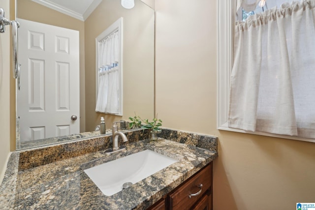 bathroom featuring vanity and ornamental molding