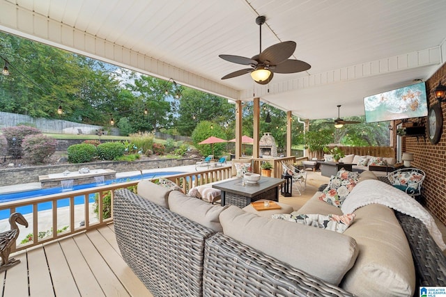 wooden deck featuring ceiling fan and an outdoor hangout area